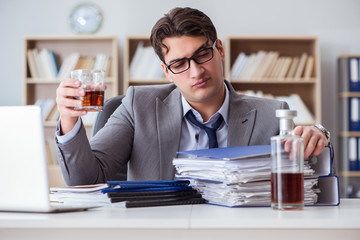 Businessman drinking in the office