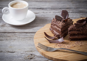 Chocolate cake on old wooden table