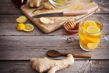  Ginger tea and ingredients on a  grunge wooden background