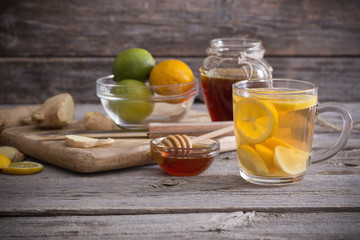  Ginger tea and ingredients on a  grunge wooden background