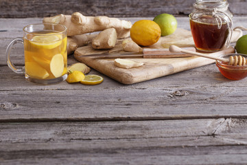  Ginger tea and ingredients on a  grunge wooden background
