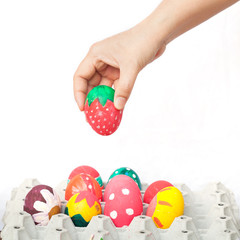 hand holding a easter egg on white