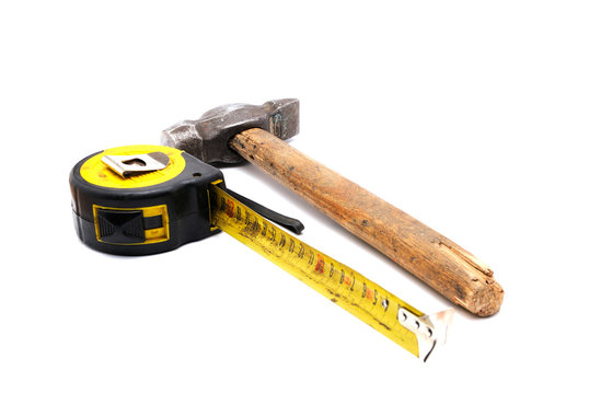 Tools collection - old tape measure and hammer