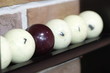 Billiard balls on a stand