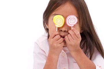 cute little girl playing, eating sugar jelly sweet candy