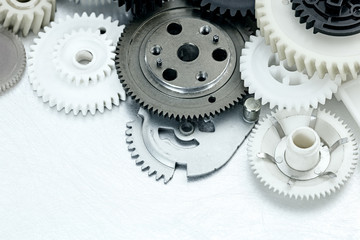 scratched metal industrial background with plastic gears. industrial equipment.