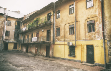 Fototapeta na wymiar Old yard with vintage buildings