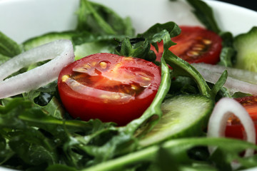 Bowl of salad on wooden table