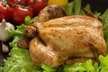 baked chicken on lettuce leaves