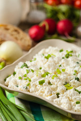 Fresh cottage cheese, served with fresh vegetables and cream.