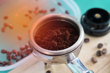 Coffee powder with coffee machine with dark roasting coffee beans. machine preparing fresh coffee or latte art and pouring.