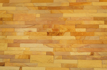 Pattern of rough sandstone wall texture for background and design.