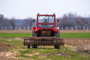 Fototapeta premium Tractor on a field