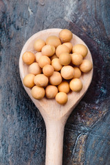 Soya beans on wooden spoon