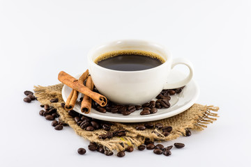 Coffee cup and beans on hemp sack