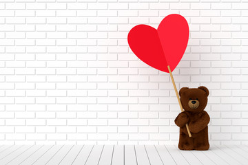 Teddy bear holding a heart-shaped red label