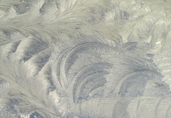 macro patterns of frost on the window glass