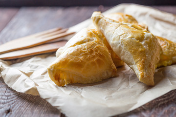 Homemade Potato Pies on Dark Wooden Table