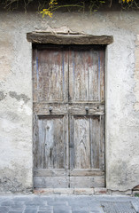 Wooden door in an old Italian house.