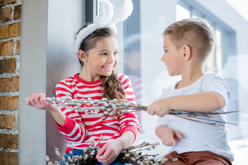 Boy and girl with catkins