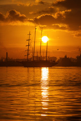 Fototapeta premium Sail boat at sunrise in Havana port, Cuba