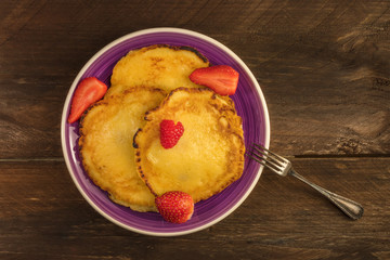 Freshly baked homemade pancakes with fresh fruit