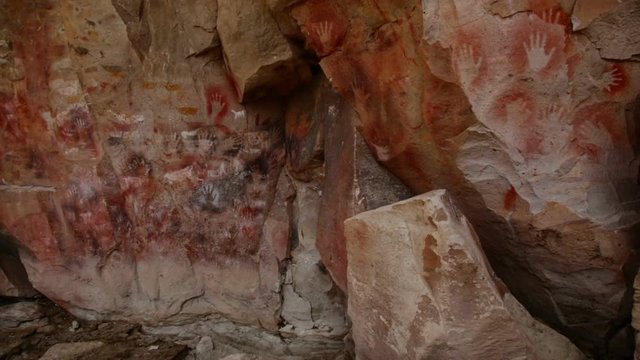 RIO PINTURAS, SANTA CRUZ, ARGENTINA - JANUARY 30, 2017: Cave paintings in Cave of hands in valley of Pinturas River (Cueva de las Manos del Rio Pinturas). Patagonia, Argentina, Santa Cruz