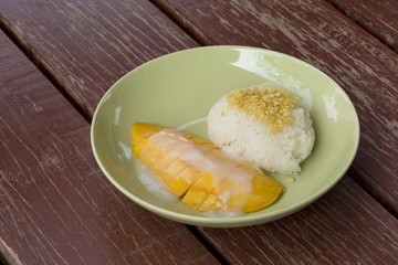 Mango with sticky rice and coconut milk,Thai style tropical dessert.