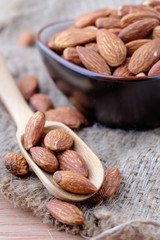 Almonds on sackcloth background