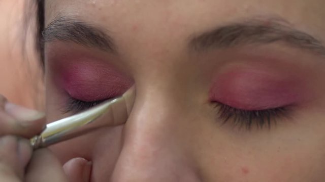 Pink Eye make-up Stock Footage. Model: Mary