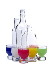 Cocktail in a glass and bottles on white background