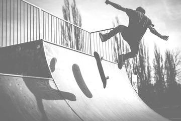 Skater doing a kickflip trick on ramp