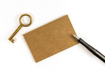 Brown kraft business card with key and ink pen