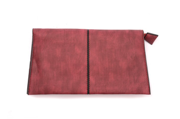 Burgundy leather clutch isolated on white