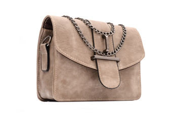 Beige leather clutch with chain isolated on white