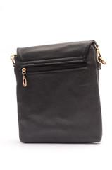 Black leather clutch classic rectangular shape. It stands on a white background in the studio. It stand in a half-turn.