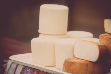 Pile of home made round cheese