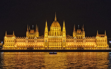 Fototapeta premium Illuminated Hungarian Parliament Building in Budapest, Hungary