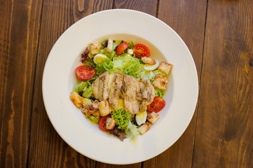 plate with salad with meat