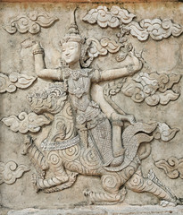 Sculpture, stone carving on the wall in the Temple of Literature Thailand