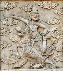 Sculpture, stone carving on the wall in the Temple of Literature Thailand
