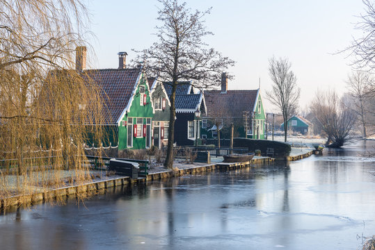Beautiful green houses and frosted canal