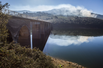 Fototapeta na wymiar La Pesga bridge over Gabriel y Galan Reservoir waters, Spain