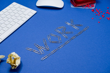 side view of work lettering and keyboard on office table