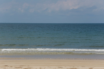 Beach and sea on a clear day.