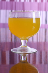 Cocktail in a glass on a colored background