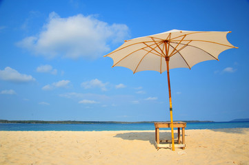 White Sand Beach with Beach Umbrella in Summer Season