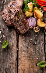 Beef steak on woode table, Fresh grilled steak with vegetable