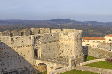  View of the Monte Sant'Angelo Castle.It is an architecture in the Apulian city of Monte Sant'Angelo, Italy (Apulia).The portal is preceded by a bridge with two arches placed across the moat.