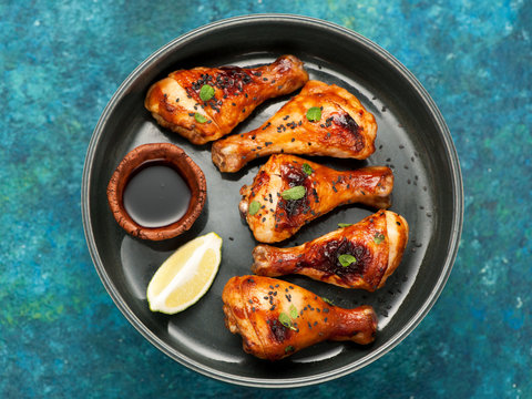 Roasted Grilled chicken drumsticks and teriyaki soy sauce
